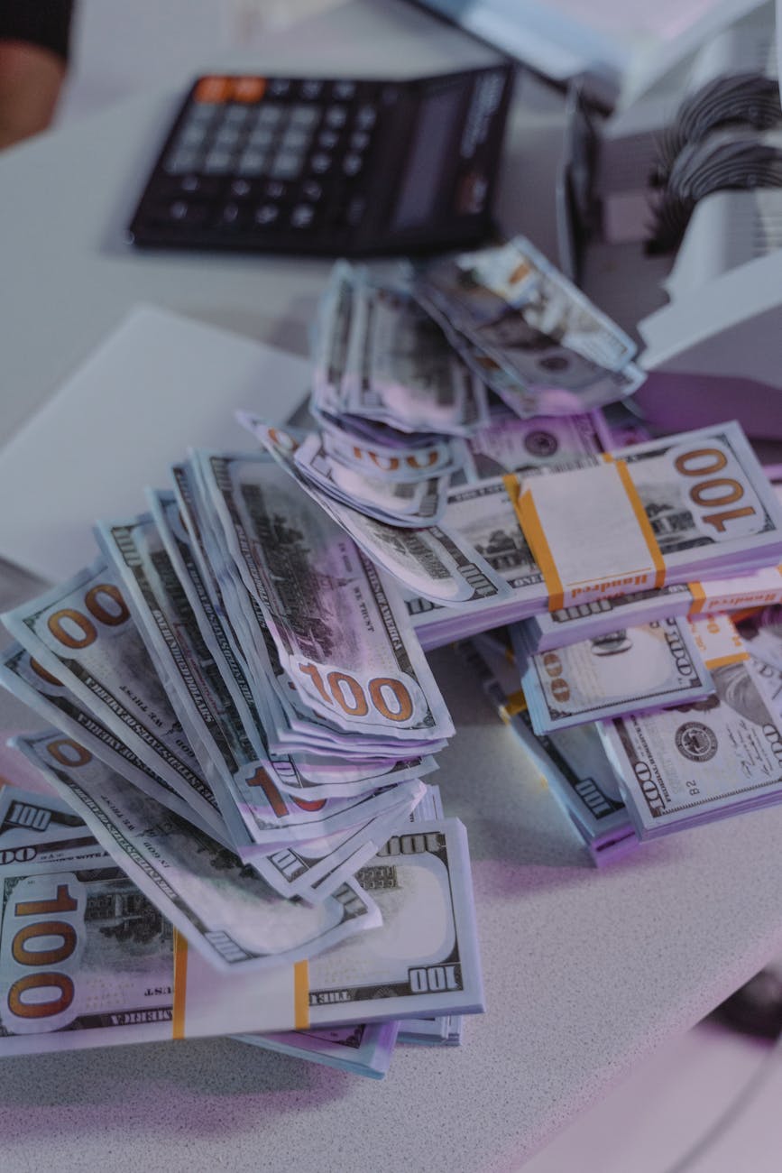 one hundred dollar bills on the table