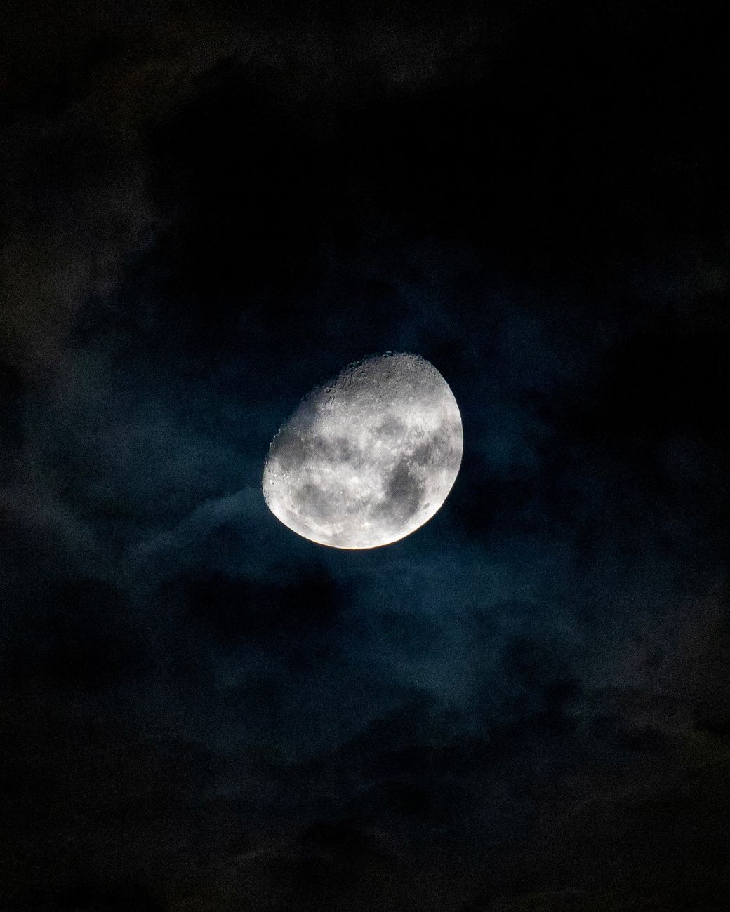 close up of a bright moon against a night sky