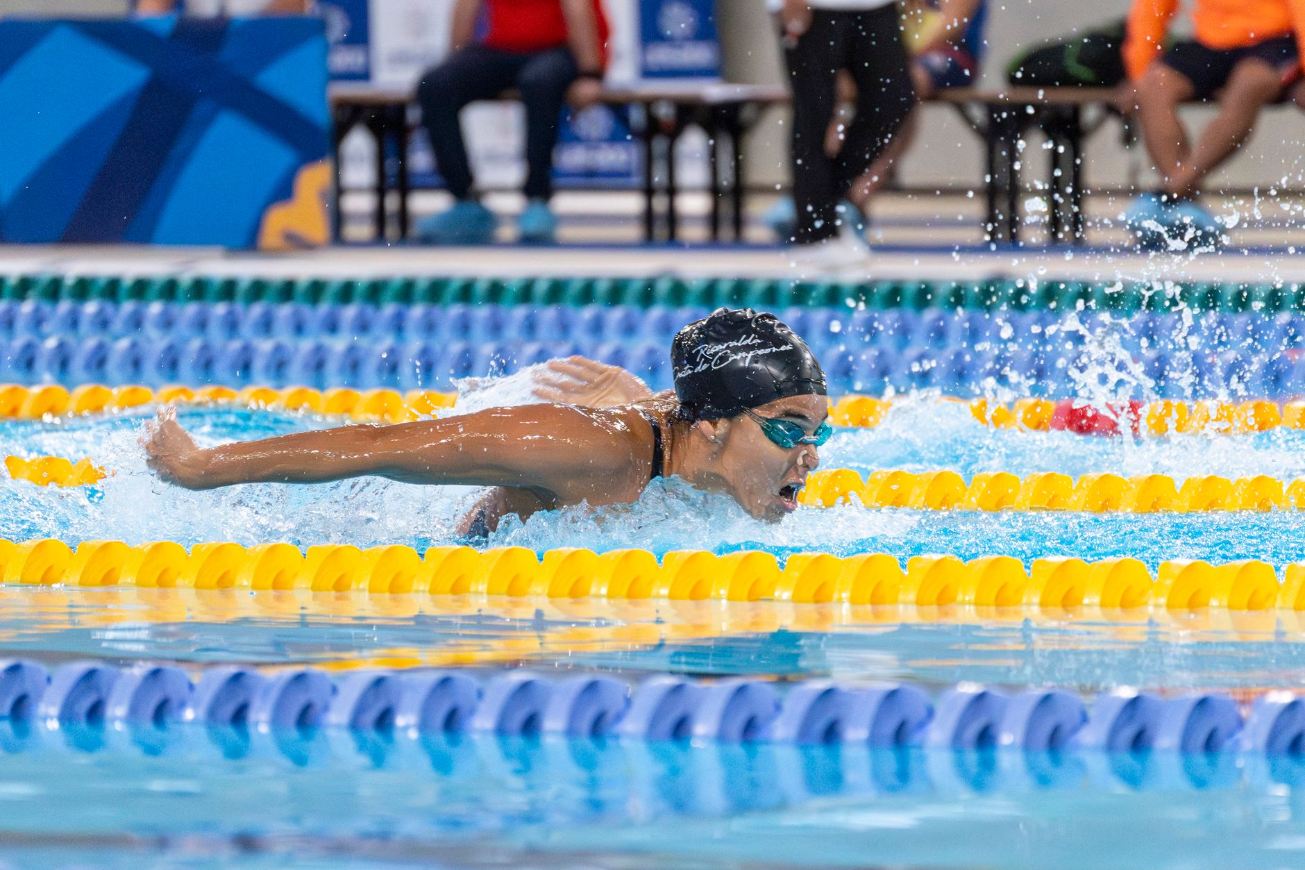 professional swimmer performing butterfly stroke